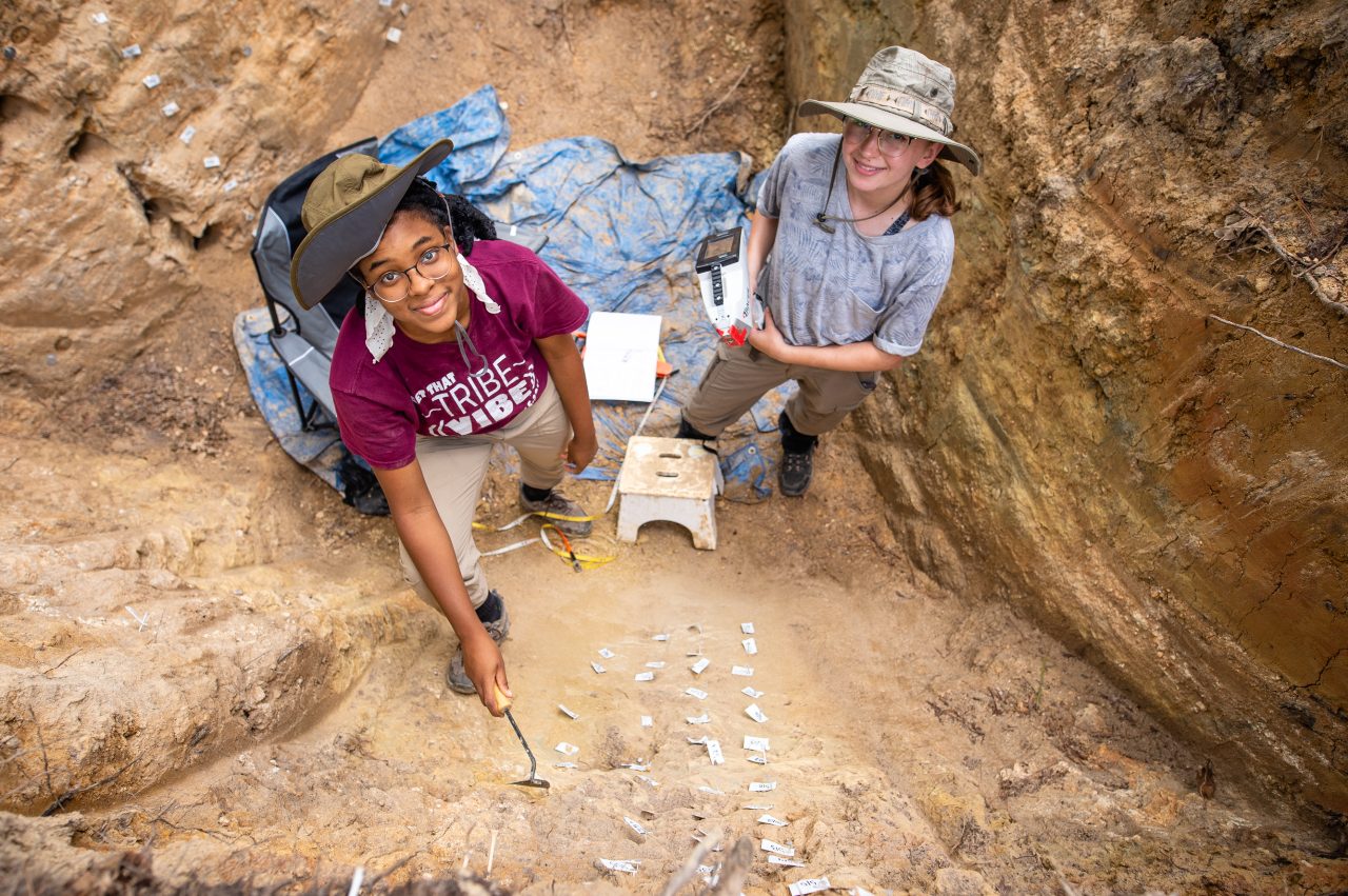 Wynnie Avent II (left) and Alexa Dodson (right) working in the field.