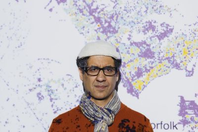 person standing in front of map